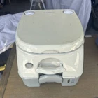 Dometic 974 Portable Toilet W/mounting Brackets -2.6 Gallon Grey Used. Price: $150.00.